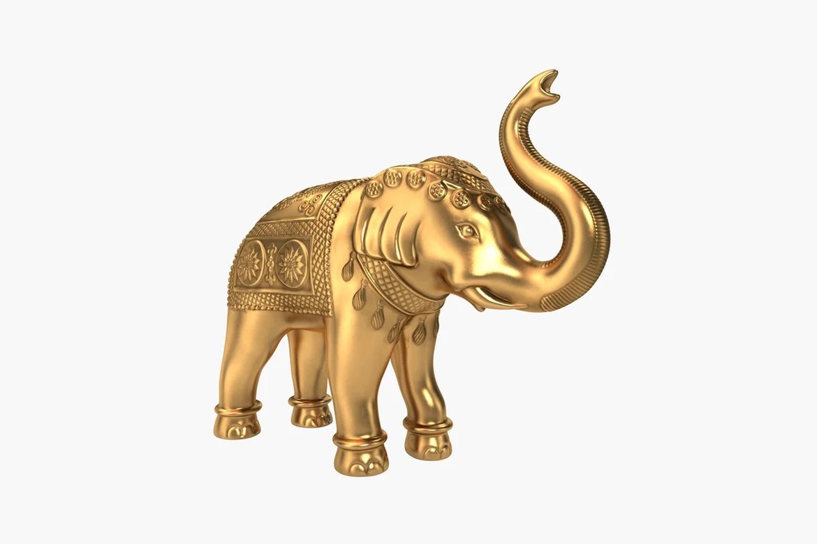 Gold elephant figurine with raised trunk and ornate detailing_0009